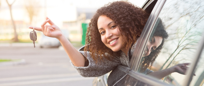 Woman with keys to new car