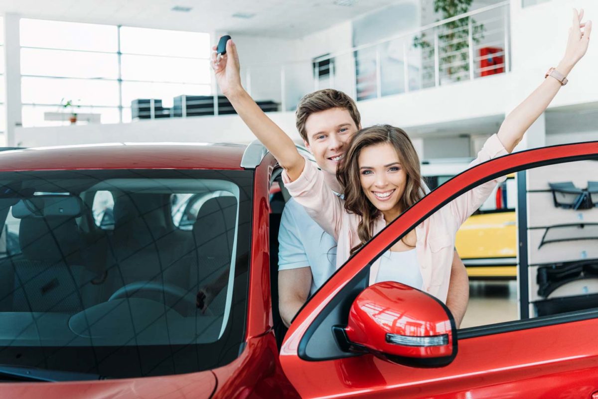 Couple getting their new car for lease