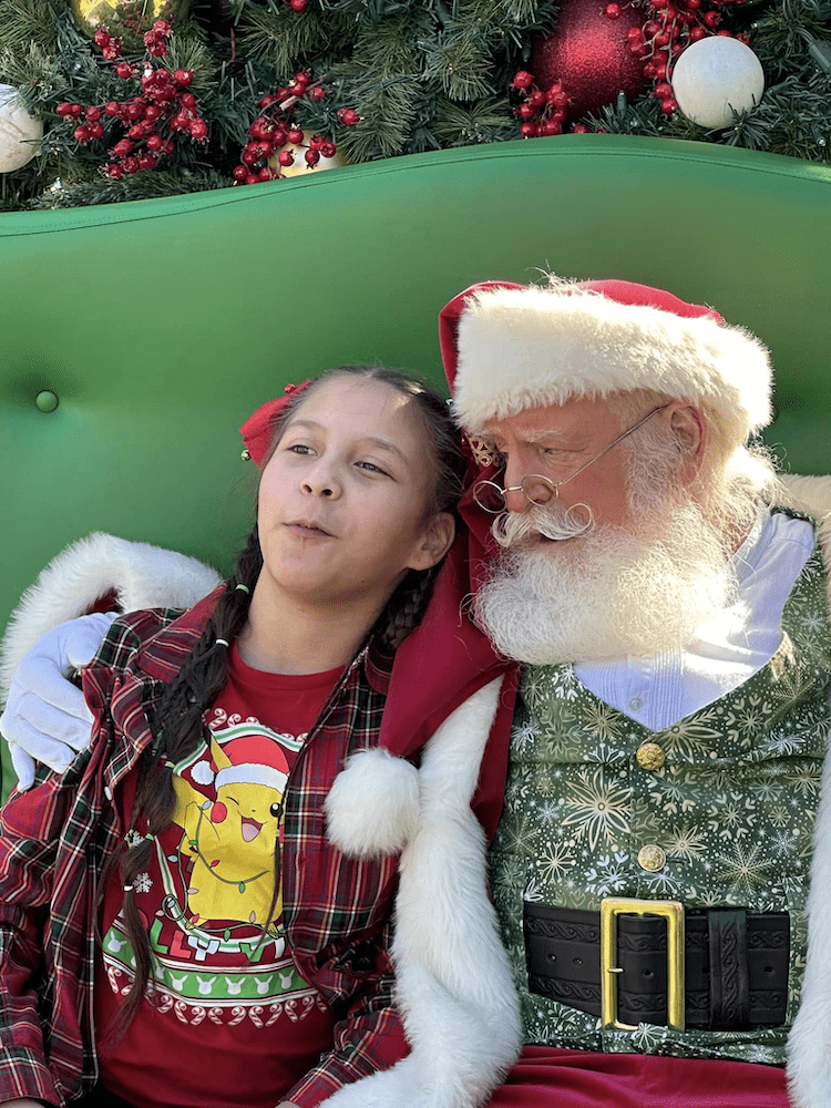 Santa whispering at The Greatest Gift Event