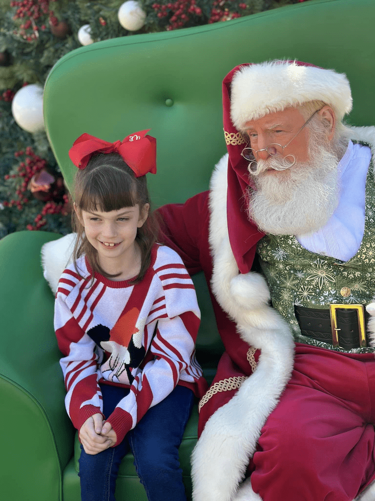 Santa and girl at The Greatest Gift Event